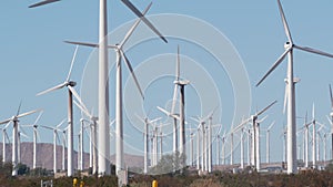 Windmills on wind farm, wind mill energy generators. Desert windfarm, USA.