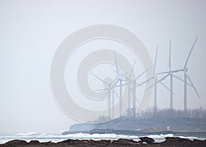 Windmills In Winter Mist