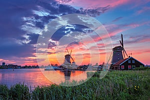 Windmills at Zaanse Schans in Holland on sunset. Zaandam, Nether