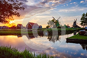 Windmills at Zaanse Schans in Holland on sunset. Zaandam, Nether