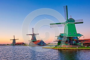 Windmills at Zaanse Schans in Holland on sunset. Zaandam, Netherlands