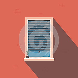 Window with roller blinds on the background of a brick wall with a shadow.