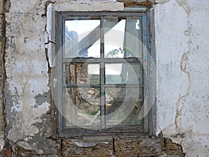 The window of an abandoned and destroyed house, in which for many years no one lives