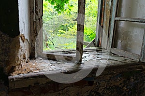 Window in abandoned school building in resettled village of Babchin in Chernobyl exclusion zone, Belarus