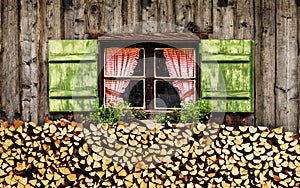 Window of an alm hut with checkered curtains
