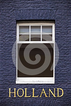 Window of an Amsterdam canal house with the text Holland photo