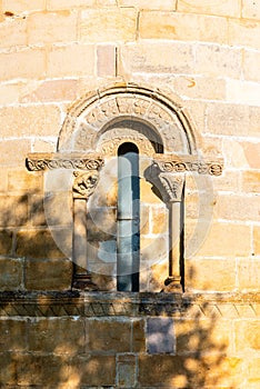 Window in the apse of a Romanesque church photo