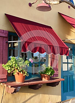 Window Awning and Flower Pots