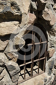 Window barred up at Bishops Castle in Colorado photo