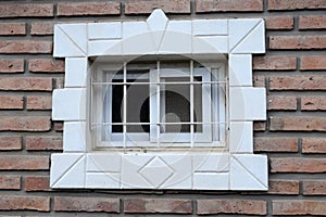 Window with bars on a brick wall