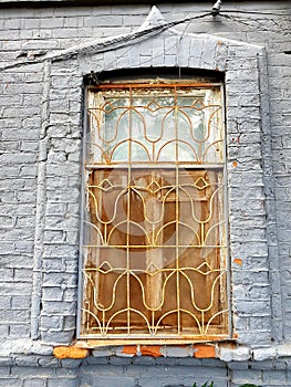 Window with bars in a stone house