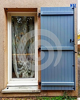 Window with blue shutter