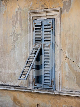 Window with blue shutters