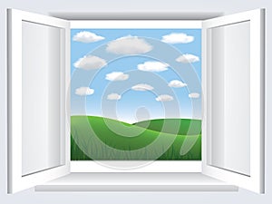 Window with blue sky, clouds and green hiil photo