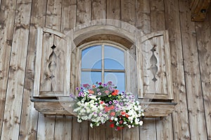 Window with blooming flowers in Austria