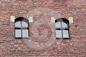 Window on the brick facade of an old house