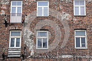 Window on the brick facade of an old house