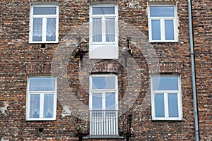 Window on the brick facade of an old house