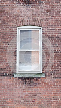 Window on brick red wall