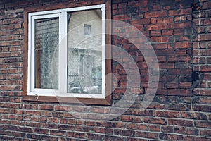 Window and brick wall view