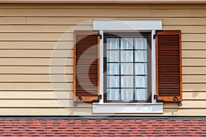 Window with brown shutters