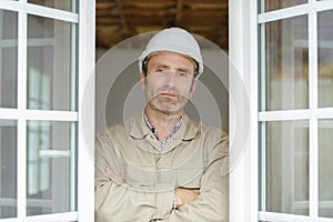 window builder man looking at camera