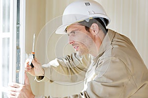 window builder working on mount new installation photo