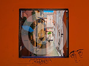 Window on the canal in Bologna, Italy. Finestrella sul canale delle Moline photo