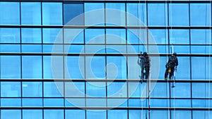 Window cleaner at work on the skyscraper