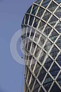 Window cleaners work on building