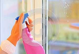 Window cleaning. Spray for cleaning in hands