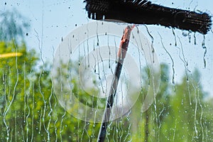 Window cleaning using telescopic water brush and wash system