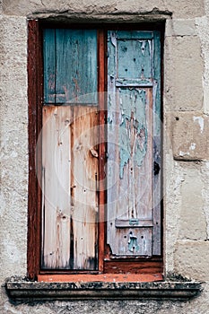 Window with closed shutters in vintage wood