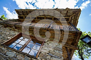 Window cloud reflections old stone and wood house