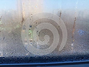 Window covered with frozen drops of condensate water