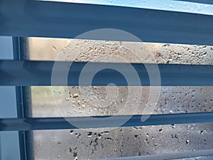 Window covered with frozen drops of condensate water