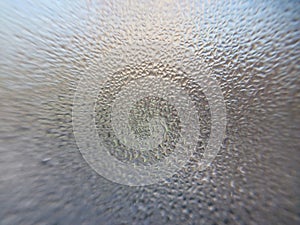 Window covered with frozen drops of condensate water