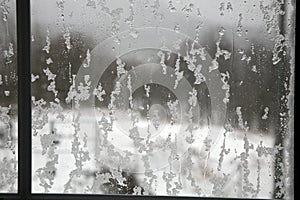 Window covered with a wet snow