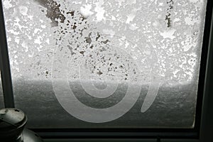 Window covered with a wet snow