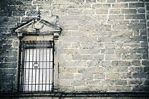 Window on creepy stonewall photo