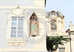 Window and cristian statue and painting