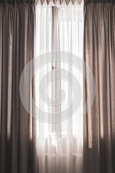 Window with curtains, vertical. Apartment design. Grey drapes with open window. Domestic interior. Modern home decoration.