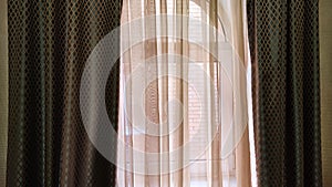Window with dark dense and tulle transparent curtains. Abstract background, location, texture, frame and copy space