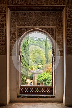 Window decorated with reliefs from the Nasrid palaces of the Alhambra in Granada, Spain