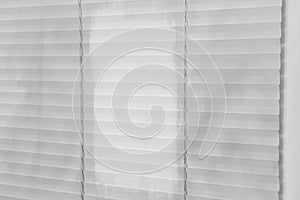 Window with dirty and clean blinds