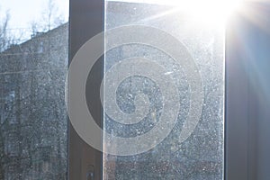 Window with dirty and dusty glass in daylight