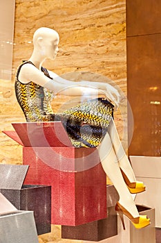 Window display with mannequin in fancy dress