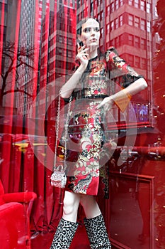 Gorgeous store window decorated for the holiday with theme of red, black and white fashionista, 5th Avenue, New York City, 2018