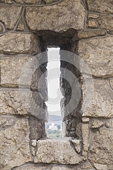 Window embrasure in an old abandoned fortress photo