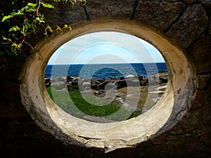 Window facing tidal pools and the ocean